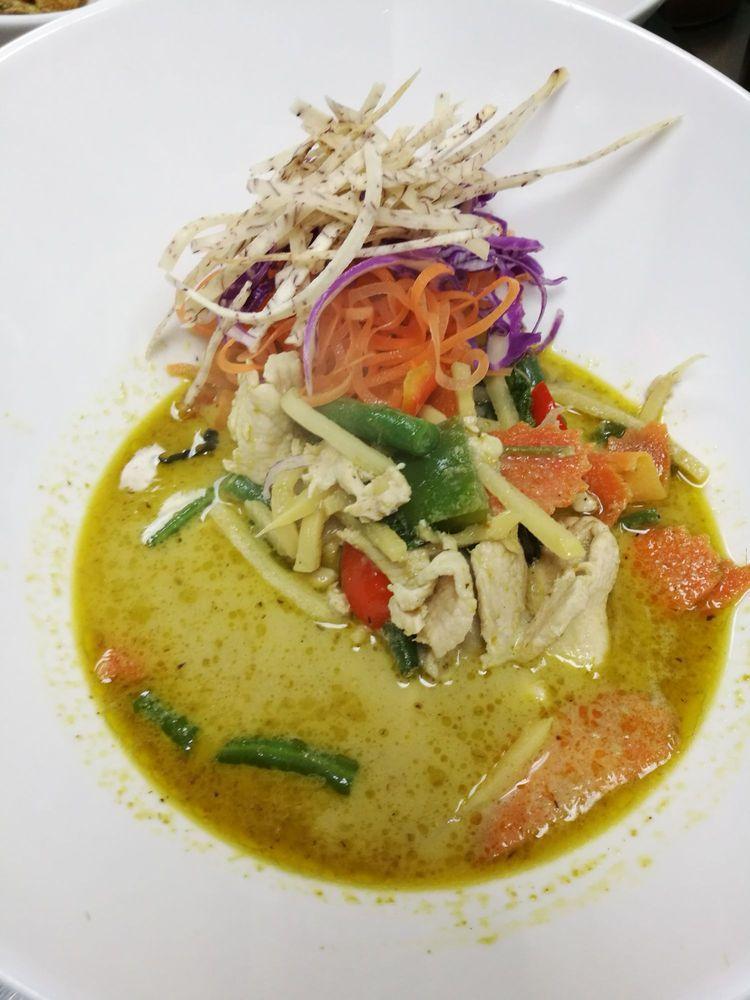 Green Curry · Thai green curry paste with bamboo shoots, eggplant and basil in coconut milk. Spicy.