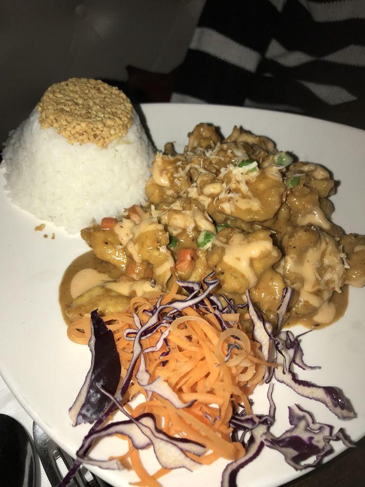 Bang Bang Bangkok Chicken · Crispy chicken with flavors of curry, peanut and coconut sauteed with green peas and carrot served over jasmine rice.