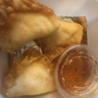 Crab Rangoon · Cream cheese with crab meat wrap in wonton wrap. Served with sweet and sour sauce.