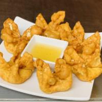 Crab Rangoon · 6 pieces. Fried wonton wrap filled cream cheese, crab and diced green onions. Served with pl...