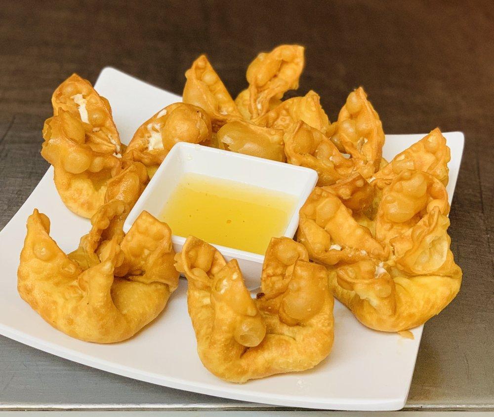 Crab Rangoon · 6 pieces. Fried wonton wrap filled cream cheese, crab and diced green onions. Served with plum sauce.