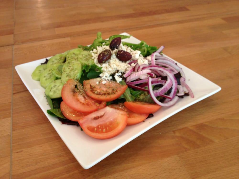 Greek Salad · Spring Mix, Tomatoes, Red Onions, Cucumbers, Bell Peppers, Feta Cheese, Kalamata Olives Topped With Greek Oregano. Your choice of Dressings on the side