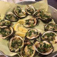 Oyster Vietnam · Grilled oyster topped with butter garlic and scallion.