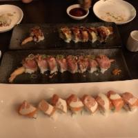 Hip Hop Roll · Shrimp tempura and avocado inside topped with garlic white tuna.