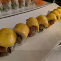 Otoro Roll · Spicy tuna and avocado topped with mango.