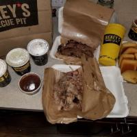Family Pack · Includes a choice of 2 meats (1 lb. each), 3 medium sides, 6 rolls and barbecue sauce