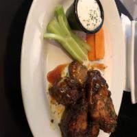 Jerk Wings · Succulent wings, jerked and grilled, topped with mambo sauce and sweet sauce and ranch dress...