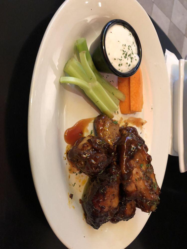Jerk Wings · Succulent wings, jerked and grilled, topped with mambo sauce and sweet sauce and ranch dressing.