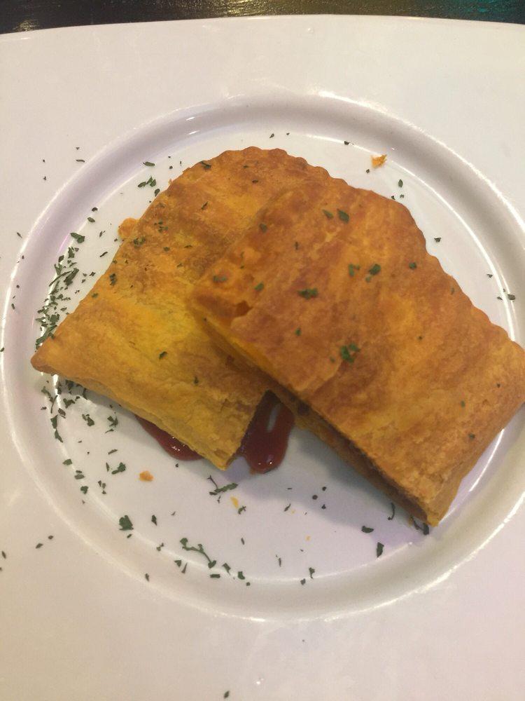 Beef Patty · Authentic Jamaican patty filled with spiced beef in a flaky crust.