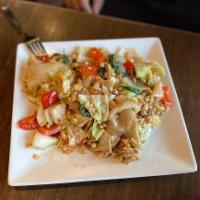 Pad Kee Mao · Drunken chef's noodles. Wok-fried broad noodles with a choice of ground meat, Thai basil, to...