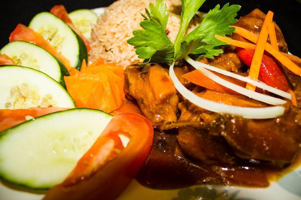 Brown Stew Chicken · Served with your choice of white rice, rice & peas, vegetables or ground provisions.