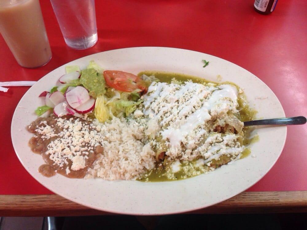 Enchiladas Verdes · With chicken, salad, rice and beans.