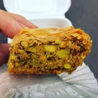 Pistachio Baklava · Layers of flaky filo dough stuffed with nuts, dipped in rich butter and topped with sweet sy...
