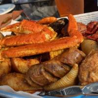 Boiling Pot · Snow crab, crawfish, shrimp, clam, mussel, calamari, sausage, shell pasta, corn, and potato ...