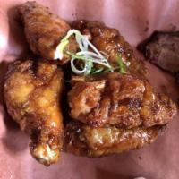Soy Garlic Wings · 6 pieces. Crispy deep-fried jumbo party wing size served with soy garlic flavor sauce.