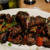 Grill Platter for 2 · Adana shish kebab, Izmir-style lamb shish kebab,  2 chicken shish kebabs,  and 4 koftes. Ser...