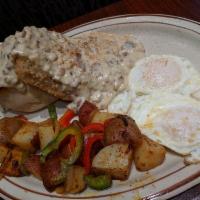 Chicken Fried Steak and Eggs Breakfast · Served with biscuit and gravy.  Served with choice of side and toast.