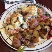 Smoked Salmon Benedict · Cream cheese, poached eggs, smoked salmon, red onions, capers, fresh spinach and Hollandaise...
