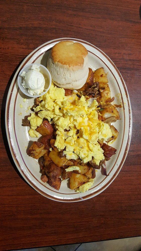 Meat Lover's Skillet · Homemade country potatoes, steak, sausage, ham, bacon, linguica, mushrooms, bell peppers, jack and cheddar cheese, topped with sour cream and green onions. Topped with 2 eggs any style and served with a home made biscuit.