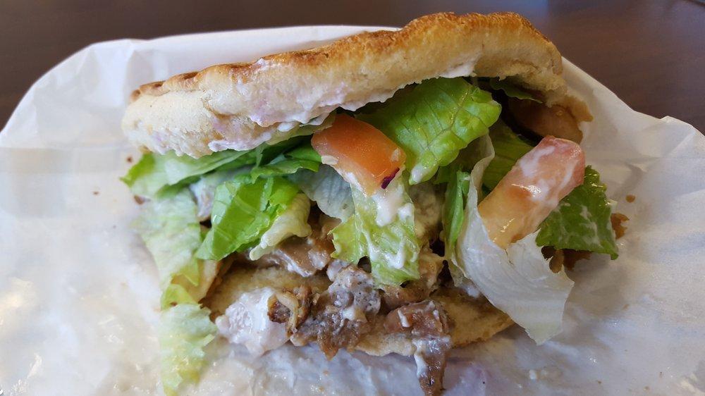 Doner Sandwich · Choice of meat on fresh baked bread with veggies and yogurt garlic sauce.
