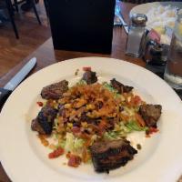 Filet Mignon Salad · Marinated filet, romaine, roast peppers with corn, jicama, black bean salad and chipotle ran...