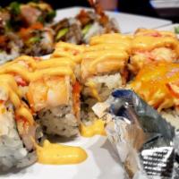 California On Fire Roll · Oven-baked roll filled with crab stick, avocado, cream cheese and topped with spicy mixed cr...