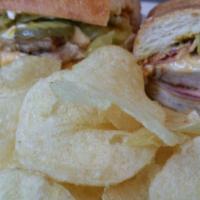 Caribbean Sandwich · Ham, roasted pork, pickle, melted Swiss cheese, mayo and mustard.