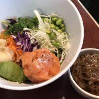 Poke Bowl · Hawaiian style bowl full of colorful toppings. Spring mix, shredded carrot, white and red ca...