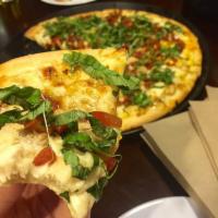Grilled Chicken Bruschetta Pizza · A thin crust pizza with creamy garlic sauce, light cheese, mesquite grilled chicken breast, ...