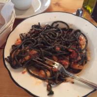 Spaghetti Calabrese · Homemade black spaghetti with shrimp, chorizo, Calabrian chili and a touch of tomato sauce. 