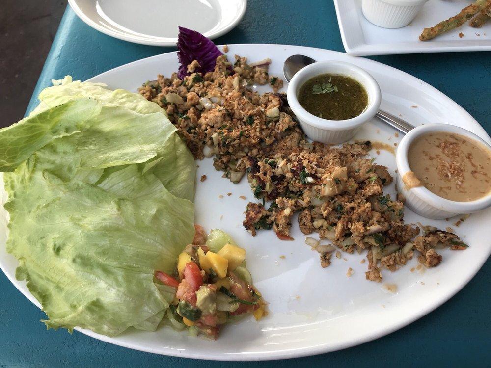 Chicken Lettuce Wraps · Minced chicken, water chestnuts, roasted cashews, toasted coconut flakes, red onion and cilantro. Served with tender lettuce cups, honey-cashew sauce and Thai peanut sauce. 