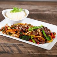 Mongolian Beef · Thinly sliced beef, shiitake mushrooms, red chili peppers, onion sticks, pea pods, ginger-ho...