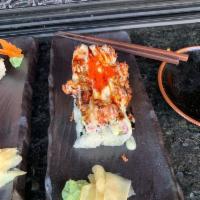 Volcano Roll · Cucumber, avocado, crab stick. (Top) Baked scallop, crab stick, masago, sweet soy sauce and ...