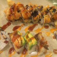Happy Roll · Shrimp tempura, cream cheese, jalapeno, salmon and deep fried with special sauce.