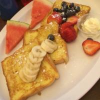 French Toast · Texas style with powdered sugar and butter. Add bacon, sausage or ham for an additional char...