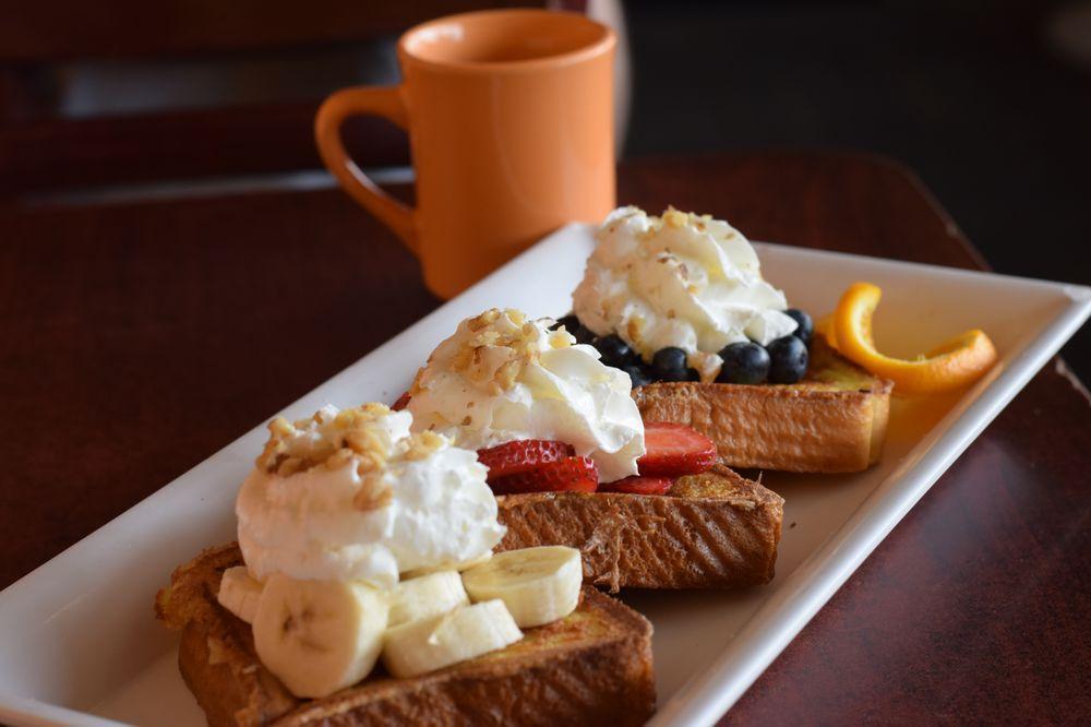 French Riviera · 3 pieces of French toast overstuffed to the max with strawberries, bananas, blueberries, topped with whipped cream and nuts.