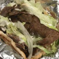 Gyro Sandwich · Strips of gyro meat with lettuce, tomato, onion, and tzatziki s
auce served on a pita