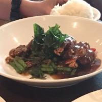 Signature Crispy Duck Basil · Onion, string bean, and bell pepper. Spicy.
