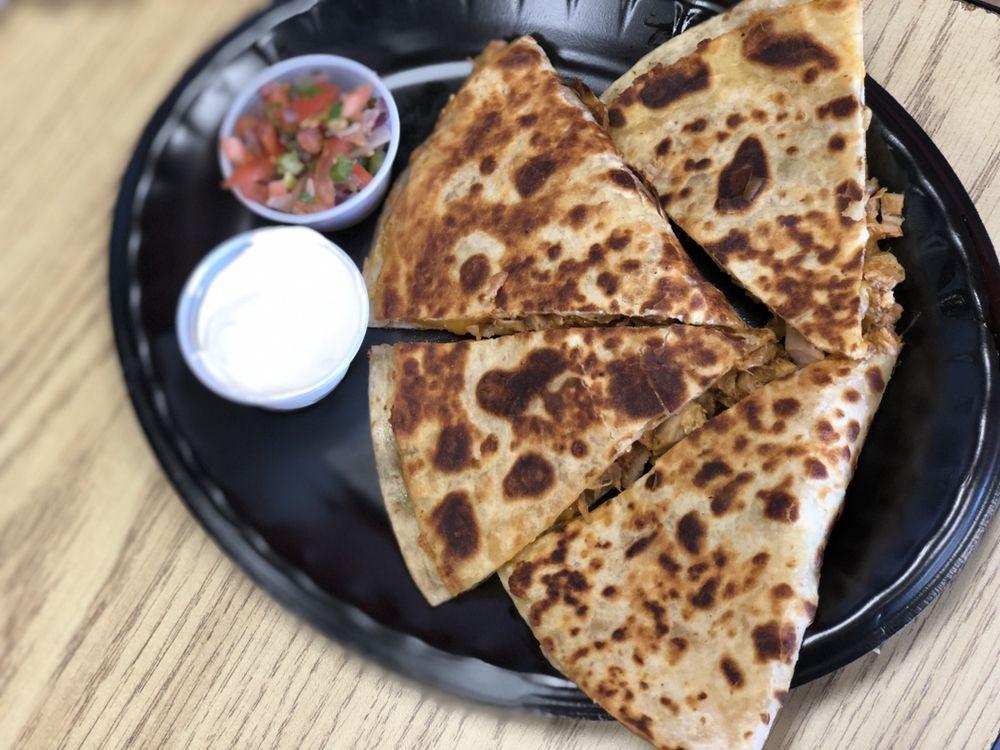 Chicken Quesadilla · chicken  ,cheese , tortilla served with  sour cream , pico de gallo on the side  and 2 traditional sauces 