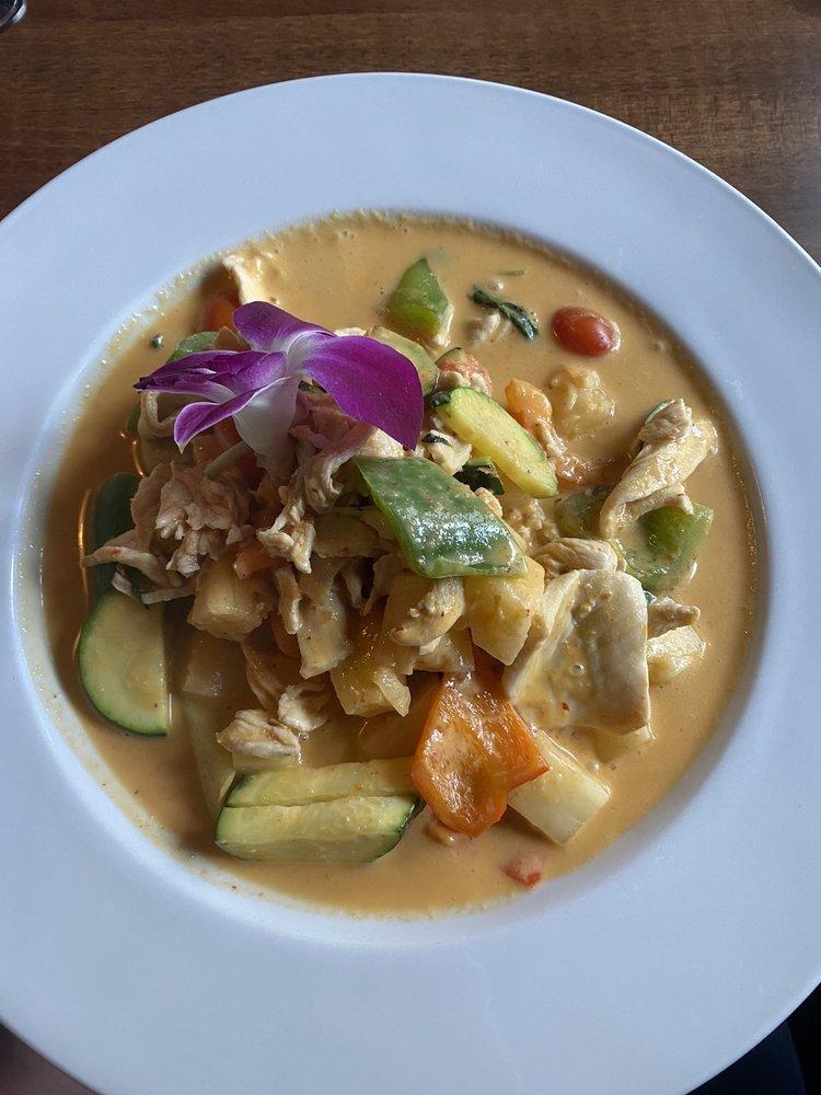 Pineapple Curry · Pineapple cooked in Thai red curry & Thai spices with coconut milk, zucchini, green & red peppers, and Thai basil. Spicy.