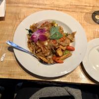Drunken Noodles · Flat rice noodles stir fried with yellow onions, green & red bell peppers, broccoli, carrots...
