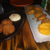 Josefina · Spit roasted pork and cheese fritters and sour orange mojo.
