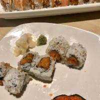 Coral Reef Roll · Salmon wrapped spicy tuna roll with tempura crunch. Contains raw components.