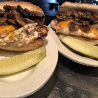 Grilled Chicken Sandwich · Seasoned chicken breast with choice of our house works of mushrooms onions and peppers on to...