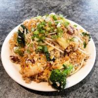 Supreme Fried Rice · Rice stir-fried with beansprouts, broccoli, eggs, green onions, pineapple, yellow curry, Chi...