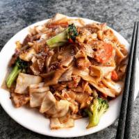Pad See Ew · Wide rice noodles stir-fried with broccoli, cabbage, eggs and carrots with your choice of pr...