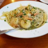 Shrimp Scampi · White wine sauce with lemon, butter and garlic and served over linguine.