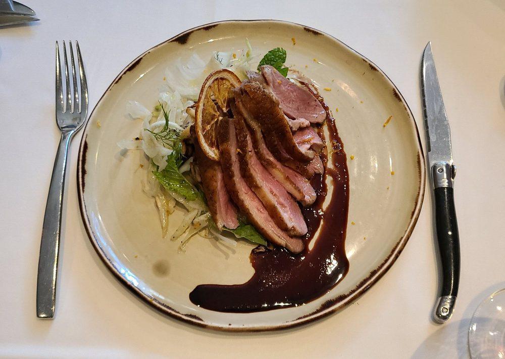 Pan Roasted Duck Breast · Thinly sliced duck breast with a blackberry blood orange glaze, fennel salad and garlic sautéed mushrooms.