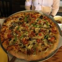 Lino's Special Pizza · Mushrooms, pepperoni, onions, sausage, peppers, tomatoes and extra cheese.