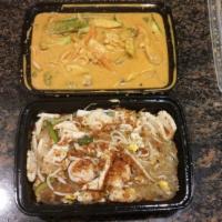 Pad Thai · Thai famous Thai noodle stir-fried with shrimps, egg, scallion and bean sprout topped with g...